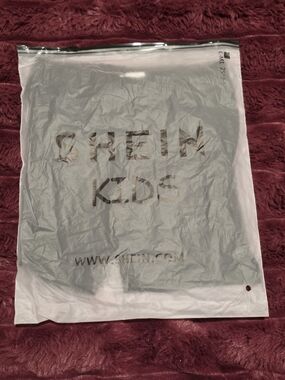 SHEIN KIDS Clear Packaging Bag - White Logo